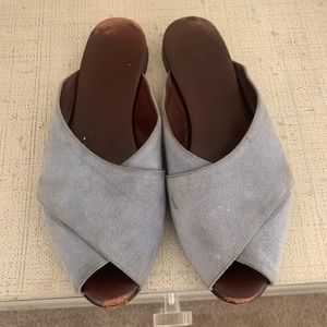 Trademark blue suede slides